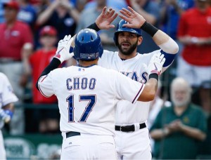 Texas Rangers' Shin-Soo Choo, left, is congratulated by Mitch Moreland, right, for his two run home run against the Houston Astros during the first inning of a baseball game, Monday, Aug. 3, 2015, in Arlington, Texas. (AP Photo/Jim Cowsert)