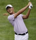 Danny Lee, from New Zealand, hits from the fairway on the 10th hole during the first round of the Bridgestone Invitational golf tournament at Firestone Country Club, Thursday, Aug. 6, 2015, in Akron, Ohio. (AP Photo/Tony Dejak)