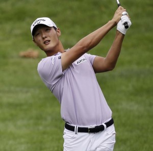 Danny Lee, from New Zealand, hits from the fairway on the 10th hole during the first round of the Bridgestone Invitational golf tournament at Firestone Country Club, Thursday, Aug. 6, 2015, in Akron, Ohio. (AP Photo/Tony Dejak)