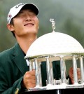 Danny Lee poses with the trophy after winning the Greenbrier Classic golf tournament at Greenbrier Resort in White Sulphur Springs, W.Va., Sunday, July 5, 2015. (AP Photo/Chris Tilley)