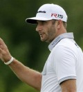 Dustin Johnson waves after making a birdie putt on the 10th hole during the first round of the PGA Championship golf tournament Thursday, Aug. 13, 2015, at Whistling Straits in Haven, Wis. (AP Photo/Jae Hong)