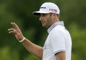 Dustin Johnson waves after making a birdie putt on the 10th hole during the first round of the PGA Championship golf tournament Thursday, Aug. 13, 2015, at Whistling Straits in Haven, Wis. (AP Photo/Jae Hong)