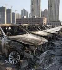 Damaged cars stand in China's northeast port city of Tianjin on Aug. 12, 2015 after suffering a series of huge explosions. While the exact cause of the explosions was not immediately known, South Korea's top carmaker Hyundai Motor is estimated to have lost 160 billion won (US$136 million) from the incident, which will be covered by its insurance. (Yonhap)
