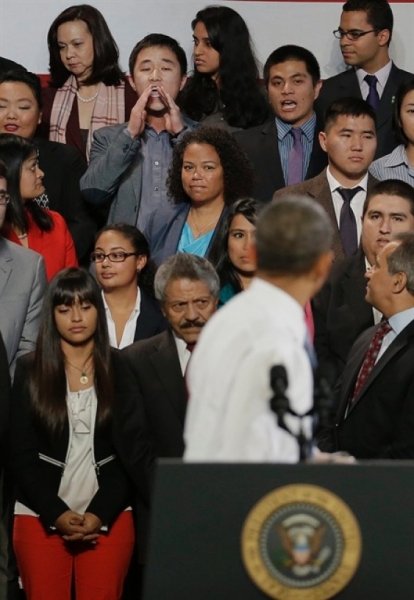 Ju Hong   heckles  President Barack Obama during the President's speech on immigration reform at the Betty Ann Ong Chinese Recreation Center in San Francisco, Calif. on Monday, Nov. 25, 2013. (AP) 