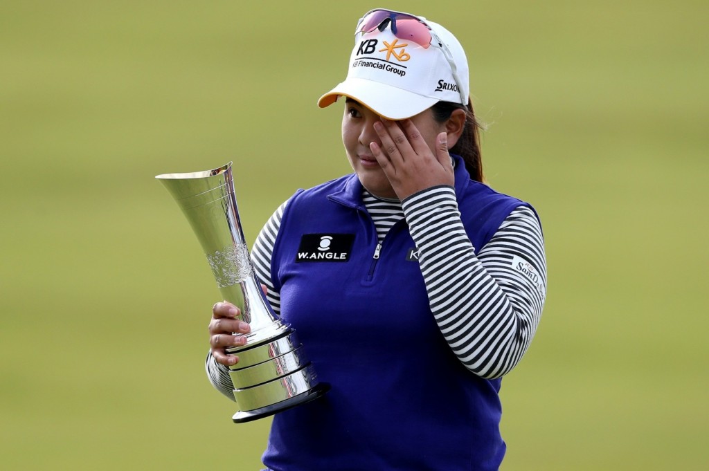 Tears of joy -- Inbee Park of South Korea wipes away tears holding the trophy after winning the Women's British Open golf championship at the Turnberry golf course in Turnberry, Scotland, Sunday, Aug. 2, 2015. (AP Photo/Scott Heppell)
