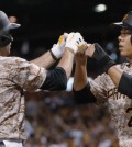 Pittsburgh Pirates' Neil Walker (18) is greeted by Jung Ho Kang after driving him in with a two-run home run during the sixth inning of a baseball game against the San Francisco Giants, Thursday, Aug. 20, 2015, in Pittsburgh. (AP Photo/Keith Srakocic)