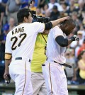 Pittsburgh Pirates' Starling Marte, right, is congratulated by teammate Jung Ho Kang after hitting a ninth-inning walkoff home run to defeat the San Francisco Giants 3-2 in a baseball game, Saturday, Aug. 22, 2015, in Pittsburgh. (AP Photo/Fred Vuich)