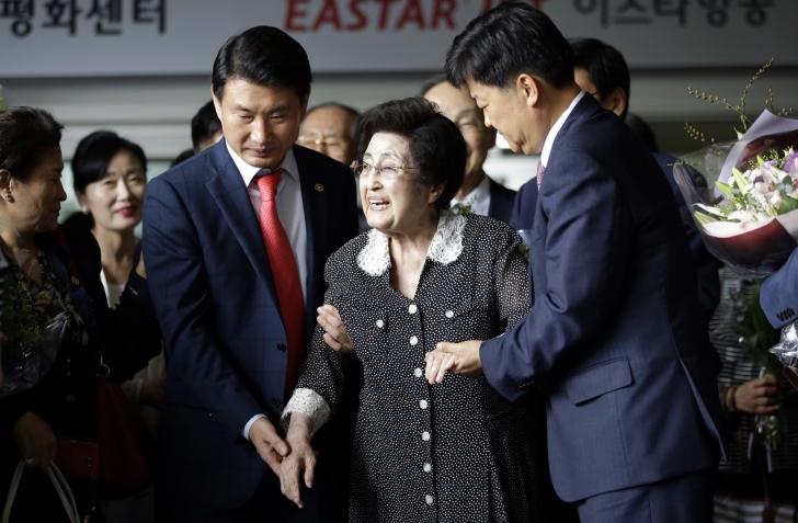 Lee Hee-ho, the widow of former South Korean President and Nobel Peace Prize laureate Kim Dae-jung, is escorted after speaking to the media at Gimpo International Airport in Seoul, South Korea, Saturday, Aug. 8, 2015, after returning from North Korea. Lee returned to Seoul after a four-day visit to North Korea that apparently ended without a meeting with North Korean leader Kim Jong Un. Lee told reporters that she wasn’t carrying any official duty on behalf of South Korea during her trip. (AP Photo/Lee Jin-man)