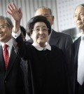 Lee Hee-ho, center, the wife of late former South Korean President Kim Dae-jung, waves as she arrives at Gimpo Airport in Seoul, South Korea, to leave for North Korea Wednesday, Aug. 5, 2015. Lee's planned Aug. 5-8 trip comes amid continuing animosity between the rival Koreas following the recent opening of a U.N. office in Seoul tasked with monitoring what activists call the North's widespread abuse of its citizens' rights.(AP Photo/Ahn Young-joon)