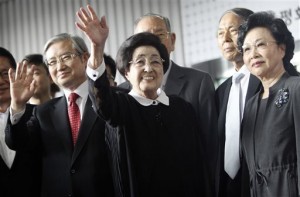 Lee Hee-ho, center, the wife of late former South Korean President Kim Dae-jung, waves as she arrives at Gimpo Airport in Seoul, South Korea, to leave for North Korea Wednesday, Aug. 5, 2015. Lee's planned Aug. 5-8 trip comes amid continuing animosity between the rival Koreas following the recent opening of a U.N. office in Seoul tasked with monitoring what activists call the North's widespread abuse of its citizens' rights.(AP Photo/Ahn Young-joon)