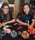 Isabelle Adams, left, with her sister Katherine have raised over $650,000 through origami to build wells for Ethiopian villages in need. (Courtesy of Facebook)