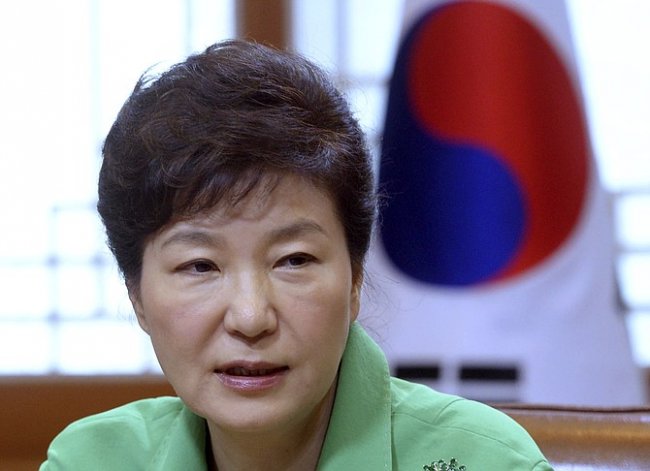 South Korean President Park Geun-hye speaks during a regular meeting at the presidential house in Seoul, South Korea, Monday, Aug. 24, 2015. Park on Monday vowed a hard line as marathon negotiations by senior officials from the Koreas stretched into a third day in an attempt to defuse a crisis that had the rivals threatening war.(Chun Jin-hwan/Newsis via AP)