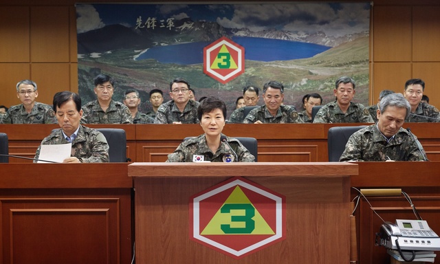 In this Aug. 21, 2015 file photo, South Korean President Park Geun-hye, bottom center, presides over a security meeting to check South Korea's military readiness against North Korea's military attack at the headquarters of Third Army in Yongin, South Korea. Once again, the Koreas are trying to disentangle themselves from violence and threats of war - this time in tense talks that have dragged out in two marathon sessions over three days. Skepticism over success abounds, but the rivals have proven time and again over the decades their mastery at pulling back from the brink. (Yonhap)