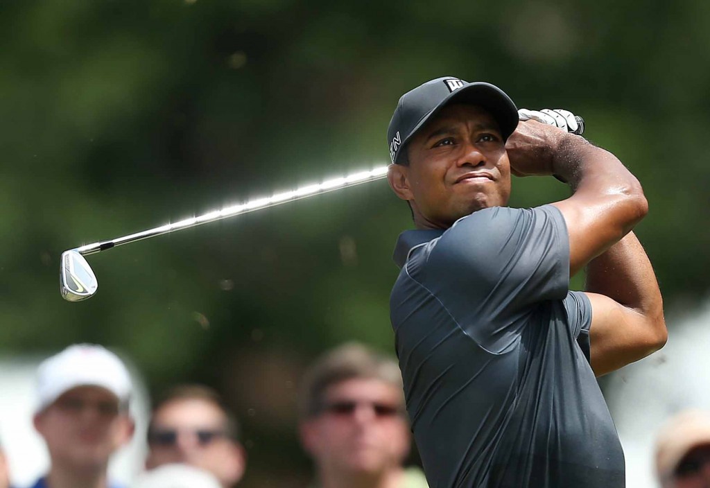 Tiger Woods tees off on the third hole during the second round of the Wyndham Championship golf tournament at Sedgefield Country Club in Greensboro, N.C., Friday, Aug. 21, 2015. (AP Photo/Rob Brown)