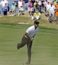 Tiger Woods watches his shot on the second hole during the second round of the PGA Championship golf tournament Friday, Aug. 14, 2015, at Whistling Straits in Haven, Wis. (AP Photo/Brynn Anderson)