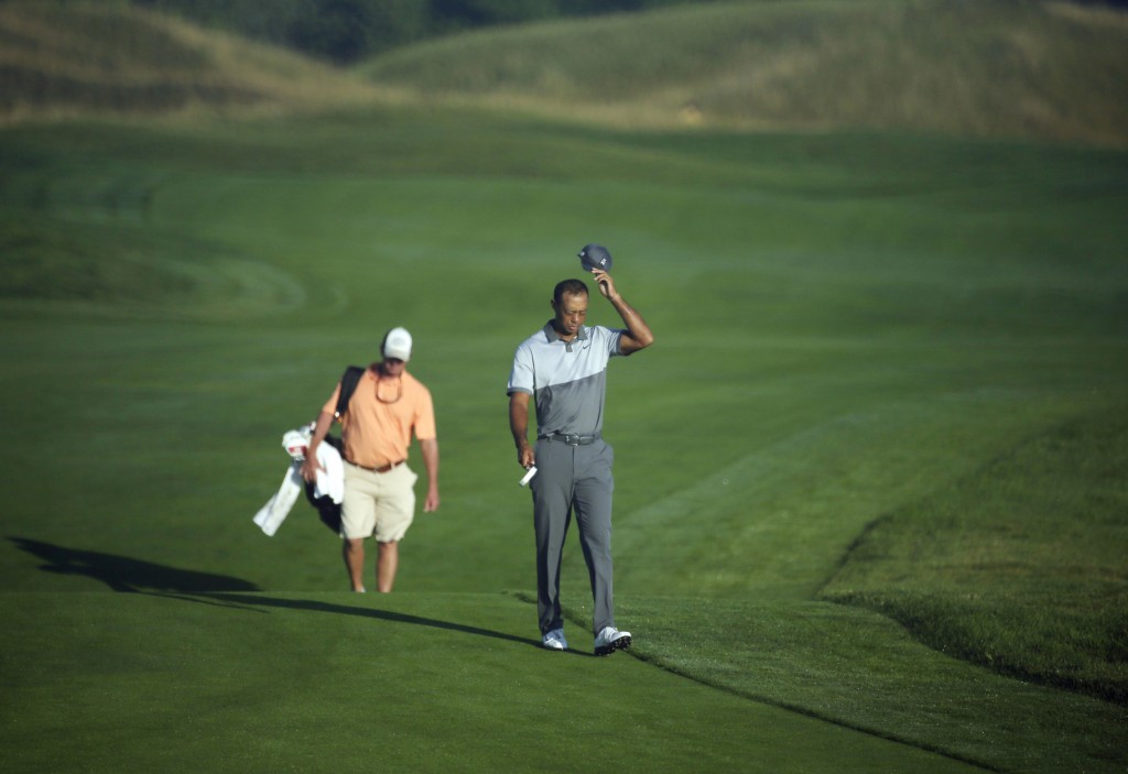 Tiger Woods walks up the first hole during a practice round for the PGA Championship golf tournament Tuesday, Aug. 11, 2015, at Whistling Straits in Haven, Wis. (AP Photo/Chris Carlson)