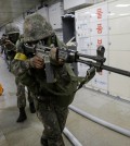 South Korean army soldiers aim their weapons during an anti-terror drill as part of Ulchi Freedom Guardian exercise, at Sadang Subway Station in Seoul, South Korea, Wednesday, Aug. 19, 2015. U.S. and South Korean forces launched Monday an annual joint military exercises, Ulchi Freedom Guardian, for a 12-day run to prepare for a possible North Korea's attack. (AP Photo/Ahn Young-joon)