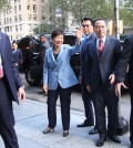 South Korean President Park Geun-hye waves at a crowd gathered in front of Korean Cultural Service New York Monday in Manhattan as she prepares to enter the center.