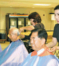 Hair stylists from a salon near Fairfax, Virginia, participate in a charity event Saturday to help the elderly in South Korea.