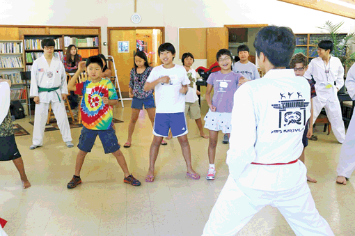 Korean Culture School students learn taekwondo under volunteers Saturday in Bethesda near Washington, D.C.