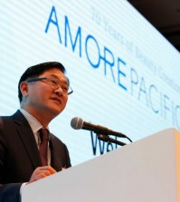 In this Sept. 9, 2015 photo, Suh Kyung-bae, chairman and CEO of AmorePacific speaks to the media during the company’s 70th anniversary media conference in Seoul, South Korea. South Korea is known around the world for Samsung phones, kimchi and Hyundai cars but ask that question in Asia and the answer might be equally be “air cushion” compacts or sleeping masks. (AP Photo/Lee Jin-man)