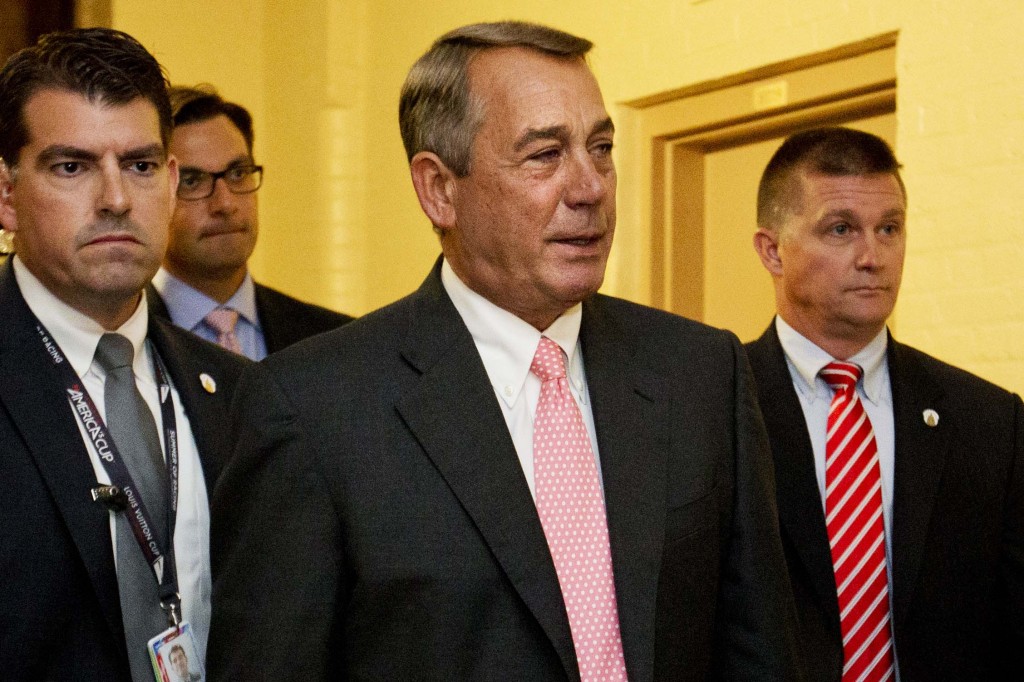 House Speaker John Boehner of Ohio, center, leaves a meeting with House Republicans on Capitol Hill in Washington, Friday, Sept. 25, 2015. In a stunning move, Boehner informed fellow Republicans on Friday that he would resign from Congress at the end of October, giving up his top leadership post and his seat in the House in the face of hardline conservative opposition. (AP Photo/Jacquelyn Martin)