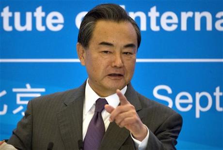 Chinese Foreign Minister Wang Yi speaks at an event to commemorate the 10th anniversary of the Sept. 19th joint statement agreed as part of the six-party talks on North Korea's nuclear program at the Diaoyutai State Guesthouse in Beijing, Saturday, Sept. 19, 2015. Yi said Saturday that the multilateral talks involving China, the United States, Russia, Japan, South Korea and North Korea are still the best way to address the nuclear issue on the Korean Peninsula. (AP Photo/Mark Schiefelbein)