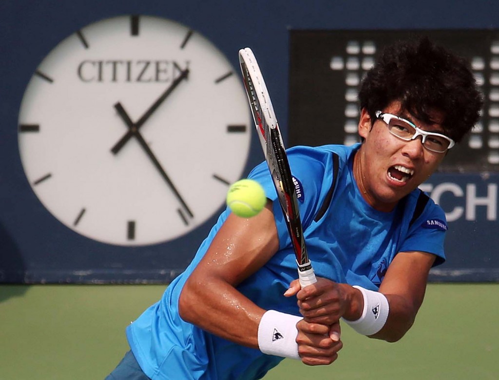Hyeon Chung, of South Korea, returns a shot to Stan Wawrinka, of Switzerland, during the second round of the U.S. Open tennis tournament, Thursday, Sept. 3, 2015, in New York. (AP Photo/Adam Hunger)