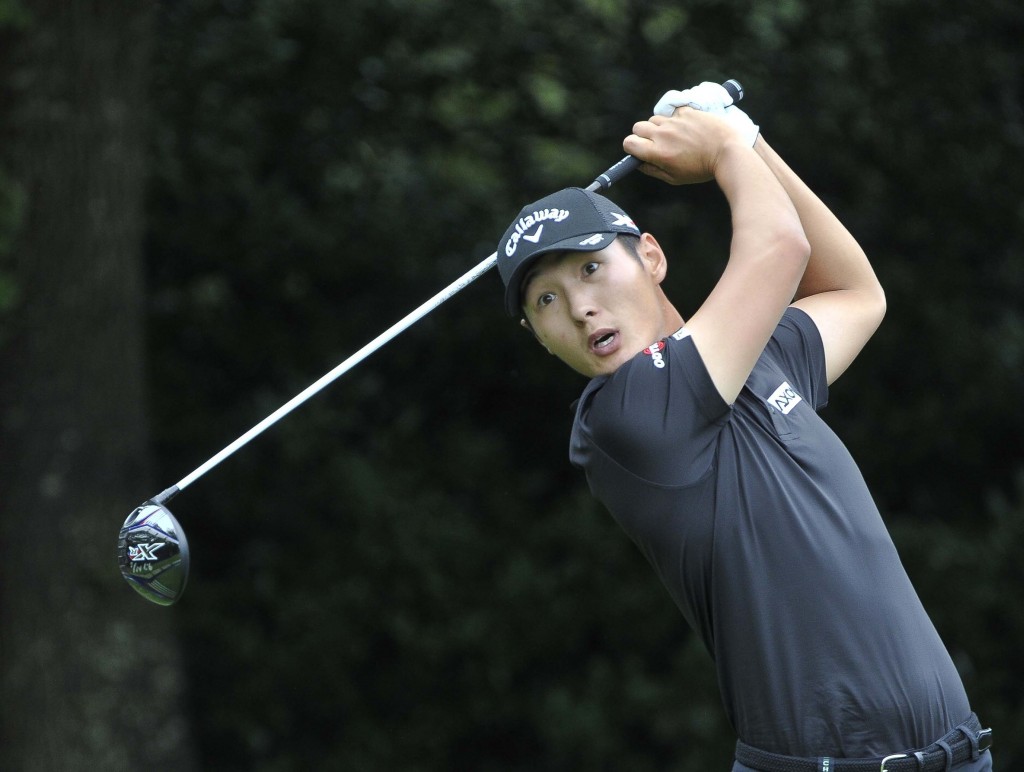 Danny Lee hits from the tee on the third hole during the second round of the Tour Championship golf tournament at East Lake Club Friday, Sept. 25, 2015, in Atlanta. (AP Photo/John Amis)