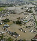 Houses are flooded due to heavy rain in Koshigaya, Saitama prefecture, near Tokyo Thursday, Sept. 10, 2015. Heavy rain is pummeling Japan for a second straight day, overflowing rivers and causing landslides and localized flooding in the eastern part of the country. (Kyodo News via AP Photo)