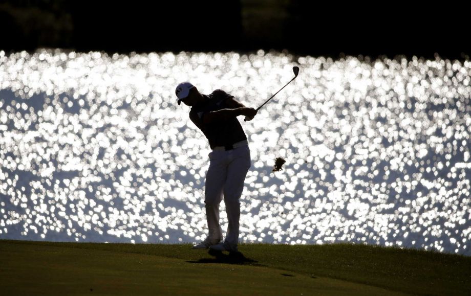 Jason Day, of Australia, hits his approach shot on the 15th fairway during the final round of the BMW Championship golf tournament at Conway Farms Golf Club, Sunday, Sept. 20, 2015, in Lake Forest, Ill. (AP Photo/Charles Rex Arbogast)