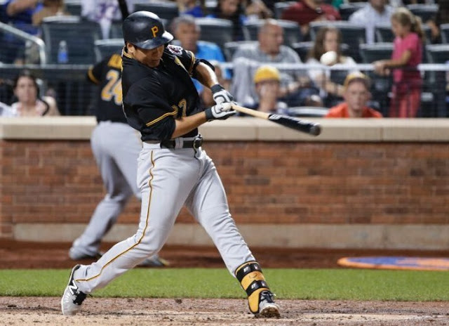 Pittsburgh Pirates' Jung Ho Kang hits a single during the fourth inning of a baseball game against the New York Mets on Friday, Aug. 14, 2015, in New York. (AP Photo/Frank Franklin II)