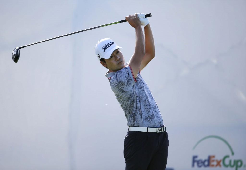 Kevin Na watches his tee shot on the first hole during the second round of the BMW Championship golf tournament at Conway Farms Golf Club, Friday, Sept. 18, 2015, in Lake Forest, Ill. (AP Photo/Charles Rex Arbogast)