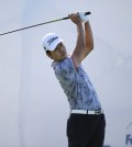 Kevin Na watches his tee shot on the first hole during the second round of the BMW Championship golf tournament at Conway Farms Golf Club, Friday, Sept. 18, 2015, in Lake Forest, Ill. (AP Photo/Charles Rex Arbogast)