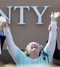 Rowan County Clerk Kim Davis cries out after being released from the Carter County Detention Center, Tuesday, Sept. 8, 2015, in Grayson, Ky. Davis, the Kentucky county clerk who was jailed for refusing to issue marriage licenses to gay couples, was released Tuesday after five days behind bars. (AP Photo/Timothy D. Easley)