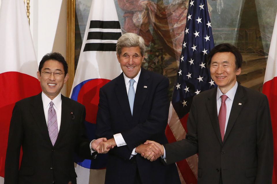 U.S. Secretary of State John Kerry, center, meets with Japan's Foreign Minister Fumio Kishida, left, and South Korea's Foreign Minister Yun Byung-se, Tuesday, Sept. 29, 2015, in New York. (AP Photo/Jason DeCrow)