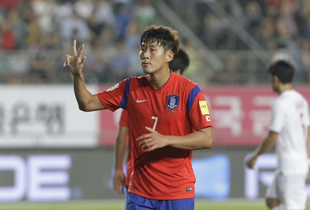 South Korea's Son Heung-min celebrates scoring a hat-trick against Laos during the Asian zone Group G qualifying soccer match for the 2018 World Cup at  Hwaseong Sports Complex Main Stadium in Hwaseong, South Korea, Thursday, Sept. 3, 2015. South Korea won 8-0.(AP Photo/Ahn Young-joon)