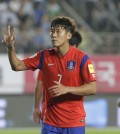 South Korea's Son Heung-min celebrates scoring a hat-trick against Laos during the Asian zone Group G qualifying soccer match for the 2018 World Cup at  Hwaseong Sports Complex Main Stadium in Hwaseong, South Korea, Thursday, Sept. 3, 2015. South Korea won 8-0.(AP Photo/Ahn Young-joon)