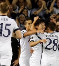 Tottenham’s Son Heung-Min, center, celebrates with teammates after scoring during the Europa League Group J soccer match between Tottenham Hotspur and Qarabag FK at the White Hart Lane stadium in London, England, Thursday, Sept. 17, 2015. (AP Photo/Frank Augstein)