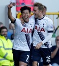Tottenham Hotspur's Heung-Min Son, left, celebrates with Christian Eriksen after scoring his side's first goal of the game against Crystal Palace  during their English Premier League match at White Hart Lane, London, Sunday Sept. 20, 2015. (Paul Harding/PA via AP)