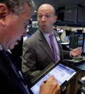 Specialist Jay Woods, right, works with trader John Bishop on the floor of the New York Stock Exchange, Wednesday, Sept. 2, 2015. U.S. and global stock markets were recovering in early morning trading Wednesday after a sharp sell-off a day earlier. Still, investors remain on edge after a plunge in stocks Tuesday that was triggered by reports showing slowing growth in China. (AP Photo/Richard Drew)