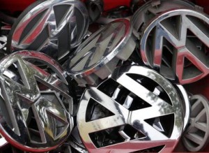 Volkswagen ornaments sit in a box in a scrap yard in Berlin, Germany, Wednesday, Sept. 23, 2015. The revelation that Volkswagen rigged diesel-powered cars to emit lower emissions during EPA tests is particularly stunning since Volkswagen has long projected a quirky brand image with an emphasis on being environmentally friendly -- an image that now appears in tatters. (AP Photo/Michael Sohn)