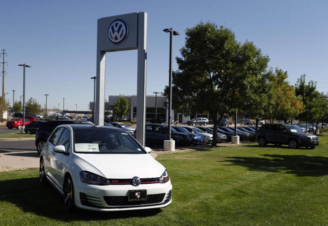 Volkswagens are on display on the lot of a VW dealership in Boulder, Colo., Thursday, Sept. 24, 2015. Volkswagen is reeling days after it became public that the German company, which is the world's top-selling carmaker, had rigged diesel emissions to pass U.S. tests. (AP Photo/Brennan Linsley)