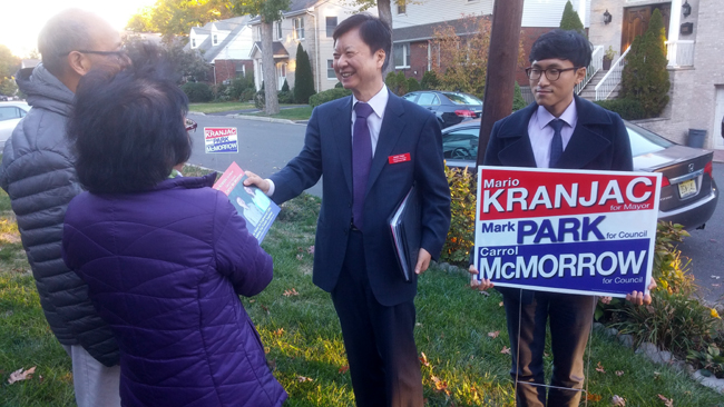 Englewood Cliffs Town Council candidate Park Myung-geun speaks to voters during a door-to-door campaign.