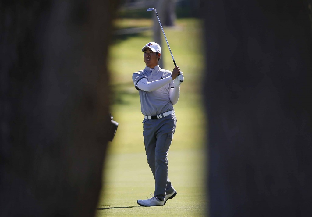 D.H. Lee of South Korea hits from the fairway on the ninth hole during the first round of the Shriners Hospitals for Children Open golf tournament Thursday, Oct. 22, 2015, in Las Vegas. (AP Photo/Isaac Brekken)