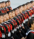 North Korean girls wear replica grenades as they parade in Pyongyang, North Korea, Saturday, Oct. 10, 2015. North Korean leader Kim Jong Un declared Saturday that his country was ready to stand up to any threat posed by the United States as he spoke at a lavish military parade to mark the 70th anniversary of the North's ruling party and trumpet his third-generation leadership. (AP Photo/Wong Maye-E)