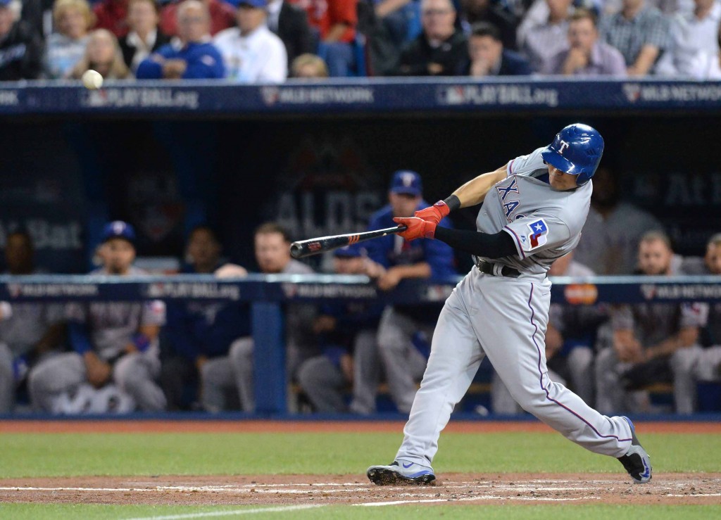 Texas Rangers' Choo Shin-soo hits a home run against the Toronto Blue Jays during the third inning in Game 5 of baseball's American League Division Series, Wednesday, Oct. 14, 2015 in Toronto. (Chris Young/The Canadian Press via AP)