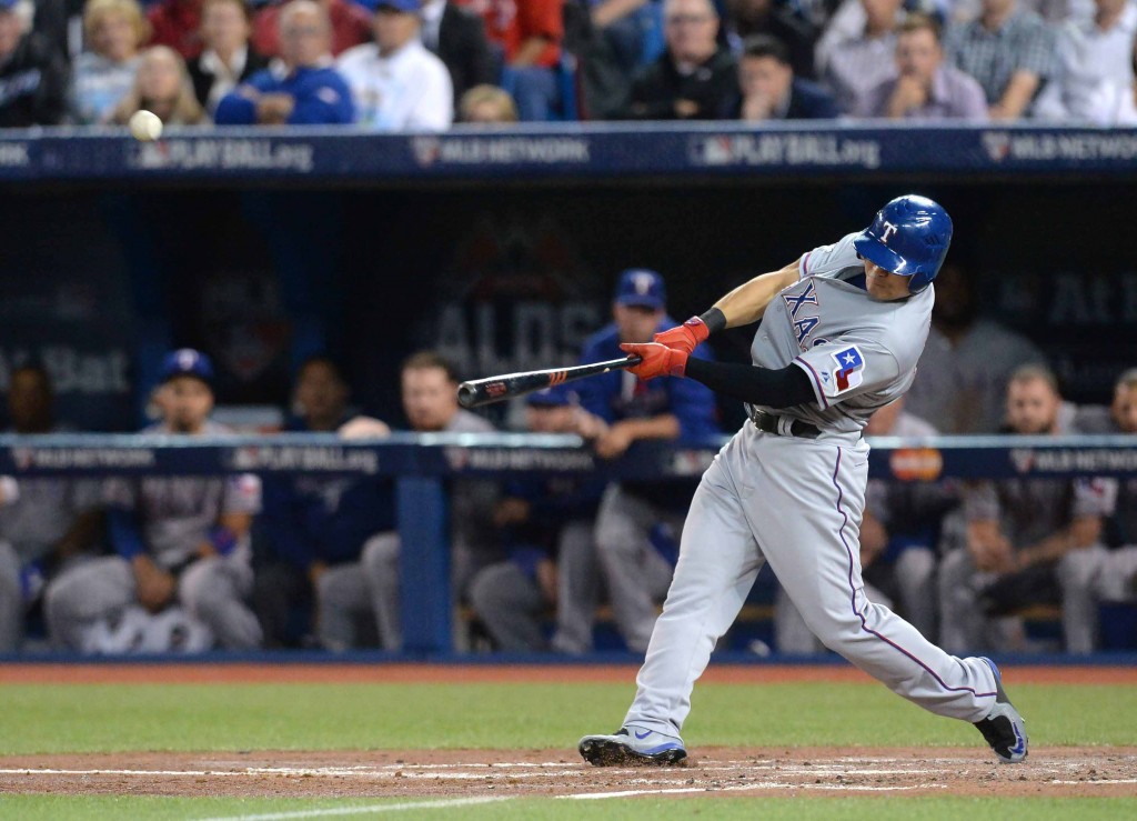 Texas Rangers' Choo Shin-soo hits a home run against the Toronto Blue Jays during the third inning in Game 5 of baseball's American League Division Series, Wednesday, Oct. 14, 2015 in Toronto. (Chris Young/The Canadian Press via AP) 