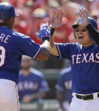 Texas Rangers Adrian Beltre (29) celebrates his two run home run with teammate Shin-Soo Choo, of South Korea, during the sixth inning of a baseball game against the Los Angeles Angels in Arlington, Texas, Sunday, Oct. 4, 2015. Choo also scored on the play. (AP Photo/LM Otero)