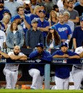 Los Angeles Dodgers watch from the dugout during the ninth inning against the New York Mets in Game 5 of baseball's National League Division Series Thursday, Oct. 15, 2015, in Los Angeles. The Mets won 3-2. (AP Photo/Lenny Ignelzi)